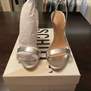 Never worn silver sandal. Perfect condition